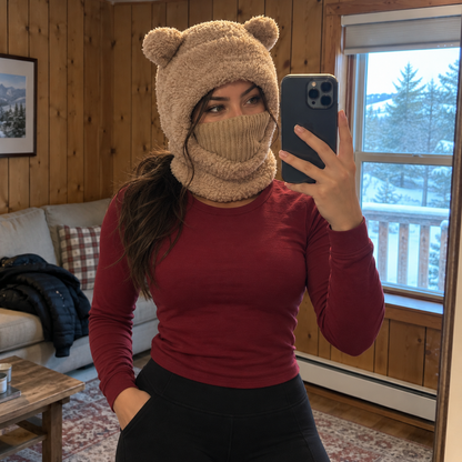 Bear hood with raised face panel, styled with a burgundy top and black leggings in a cabin mirror selfie