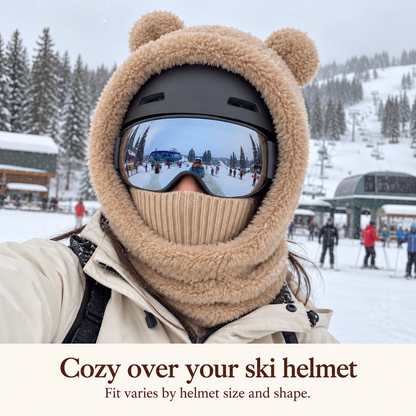 Bear hood worn over a ski helmet with goggles; fit varies by helmet size and shape